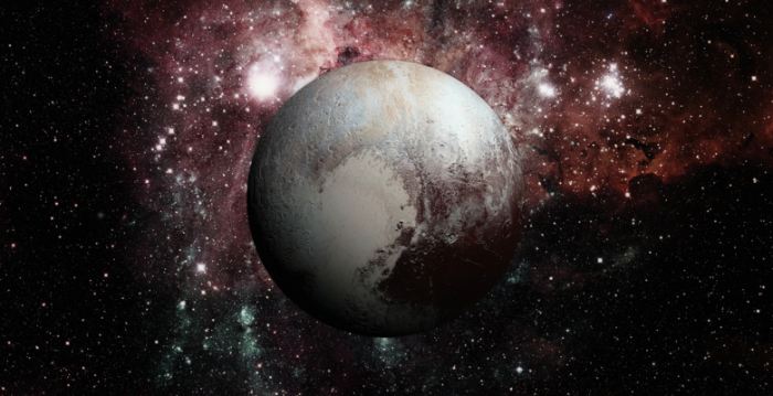 Three of Pluto's moons bound by gravity in a peculiar pattern